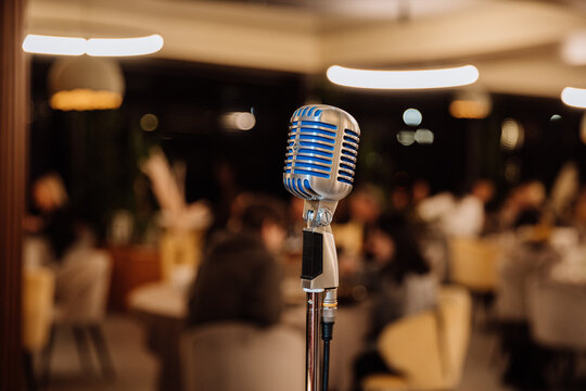 Retro microphone on stage in cozy restaurant, ready for live music, speech or standup show