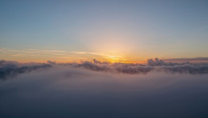 A glimpse of clouds against a bright blue sky, showcasing seasonal change