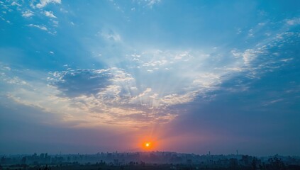 Dawn breaking with vibrant hues in the sky