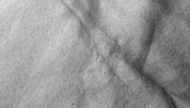 Close-up of a soft grey felt texture, suitable for minimalist design backgrounds