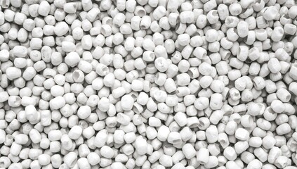 Gray low density polyethylene masterbatch granules on a white backdrop, used as a colorant in plastic manufacturing
