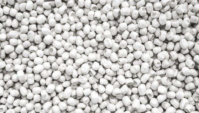 Gray low density polyethylene masterbatch granules on a white backdrop, used as a colorant in plastic manufacturing
