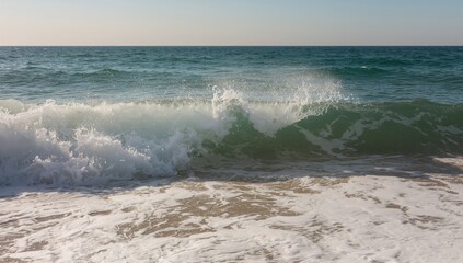 Fototapeta premium Ocean water forms a ripple along the coast.