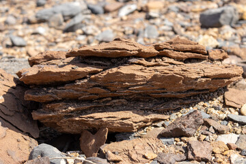 Layered Sedimentary Sandstone Rock Formation in Arid Landscape
