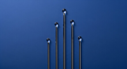 Metal Rods with Water Droplets on Blue Background