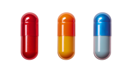Close up of three colorful capsules red orange and blue isolated on a black background in studio shot