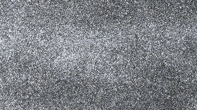 Close up texture of dark grey granite stone with speckled white and black mineral flecks creating a natural abstract background pattern