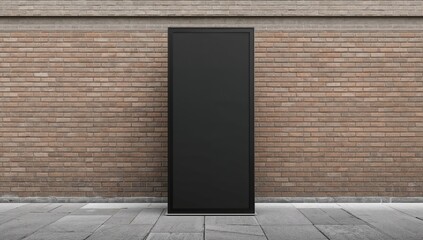 Side view of a vertical black pylon in front of a brick structure, suitable for advertising placement