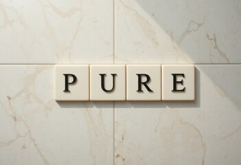Elegant Display of the Word 'Pure' on Marble Wall Tiles in Bright Lighting