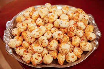 Tray with fresh golden cheese breads