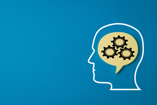 Human head outline with gears in a thought bubble.,Concept for business strategy,mental process, innovation,artificial intelligence, problem-solving,brainstorming. Blue background with copy space. - Powered by Adobe