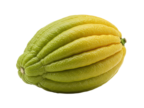Exotic yellow green fruit with deep ridges against dark backdrop