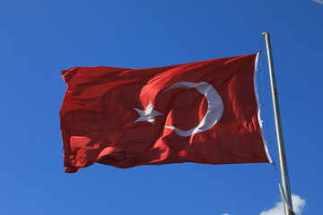 turkish flag against blue sky