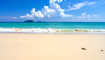 Fototapeta premium Sandy beach meets turquoise sea beneath a bright blue sky dotted with puffy white clouds, distant islands visible