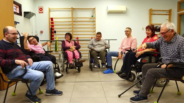 Disabled people enjoying a conversation in a support group meeting