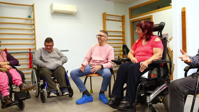 Group of people with disabilities socializing in therapy session