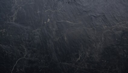 Dark grey slate stone surface, suitable for editorial header background