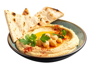Close-up of hummus with pita bread, chickpeas, parsley, and paprika in a teal bowl
