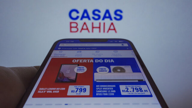 S&atilde;o Paulo, Brazil - January 27, 2025: A hand scrolls across a smartphone while using the Casas Bahia app