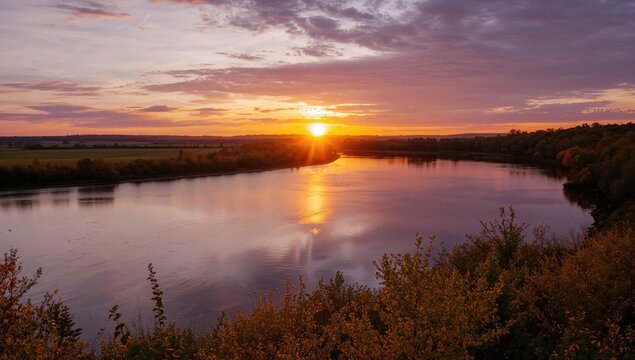 Lake under a sunset sky, serene landscape with reflections on water