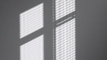 Abstract light and shadows, interplay of illumination and dark shapes on a white textured wall