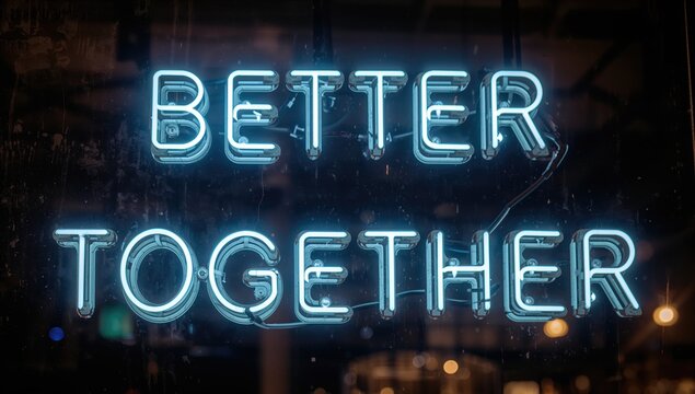 Neon inscription reading BETTER TOGETHER illuminated at night, nightlife ambiance, urban vibrancy