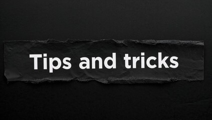 Obraz premium Advice and hacks icon. The phrase 'Advice and hacks' displayed behind ripped dark paper. Elegant dark backdrop. Business, Advice and hacks theme. Space for text.
