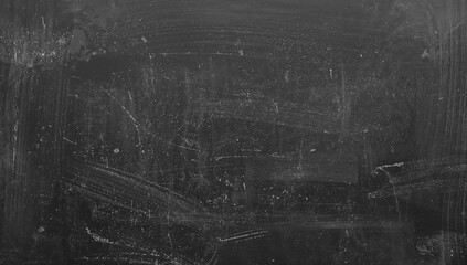 Fototapeta premium Chalk dust residue on a blackboard, usable texture for graphic design or educational materials