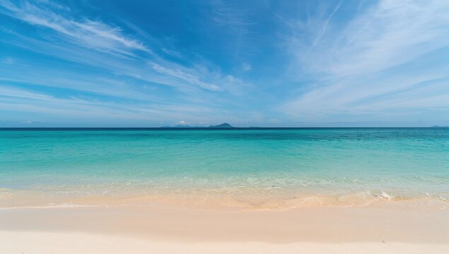 Coastal waters, clear skies, and sandy shores in a sunny summer setting
