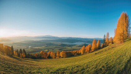 Obraz premium Landscape panorama of Caucasus mountains featuring autumn hills during the day, showcasing seasonal change