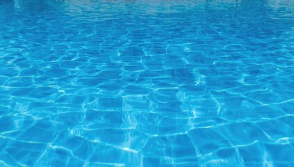 Obraz premium Blue swimming pool surface, ideal for summer leisure activities,