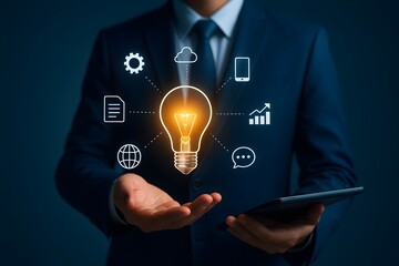 Innovation and technology concept with businessman holding glowing lightbulb and digital network icons