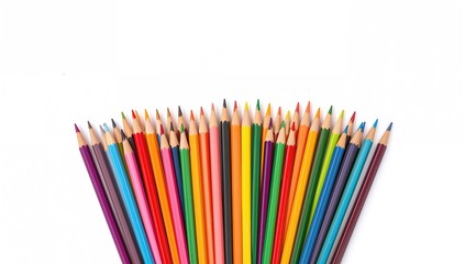 Fototapeta premium Collection of vibrant pencils arranged on a white surface, suitable for artistic projects