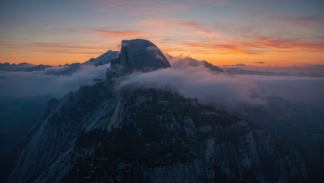 Tall peaks enveloped in mist all day long