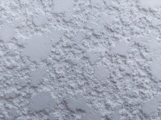 Textured white wall surface perfect for backgrounds or adding depth to your design projects today