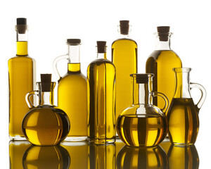 Golden olive oil assortment in glass bottles on reflective surface for culinary creations, healthy lifestyles, and Mediterranean diet promotions
