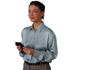 Woman in professional attire smiling and holding smartphone, displaying confidence and modern business communication, transparent background
