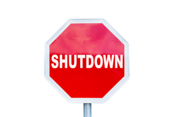 Red Stop sign with the text Shutdown isolated on white or transparent background, US government shutdown concept