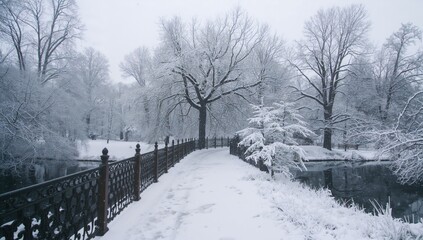 Metal railings on a snowy bridge in a winter garden