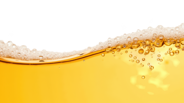 Golden liquid with bubbles creates refreshing and inviting appearance, perfect for beverages or celebrations