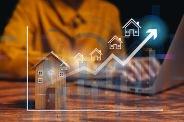 Real estate investment concept. Wooden house model with upward growth chart showing property value increase, financial planning, and housing market trend analysis.
