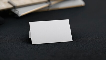 Business cards displayed on a dark surface, efficient layout for professional networking
