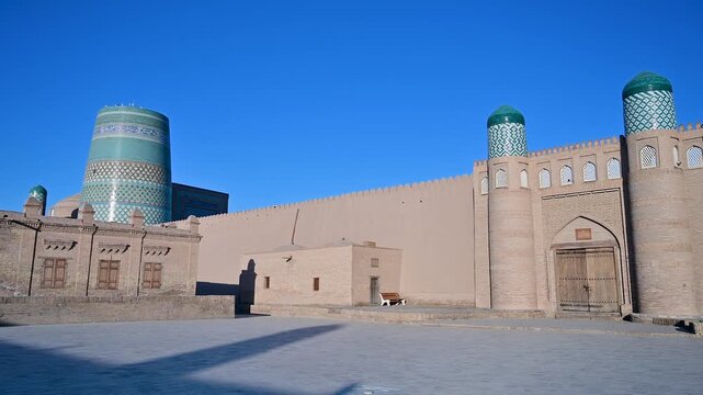 Kalta Minor Minaret and the entrance to Kunya Ark in Khiva, Uzbekistan