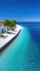 Tropical Resort With White Villas Lined Up Along A Pristine White Sand Beach With Lush Green Trees Under A Clear Blue Sky And Turquoise Ocean Water