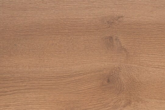Melamine surface emulating wood grain for backdrop use. Coarse wooden material ideal for interior decoration and furniture projects. Natural wood pattern texture suited for indoor design and