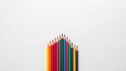 Fototapeta premium Color pencils arranged on a white background, ideal for creative projects