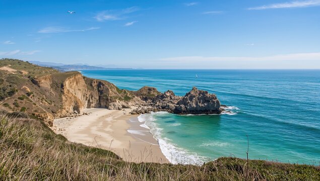 Seaside cliffs with rocky shores and clear blue waters on a sunny day
