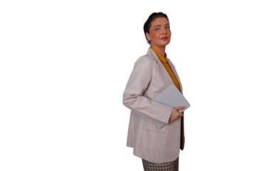 Confident businesswoman wearing a blazer and holding a tablet, posing in a professional studio setting with transparent background