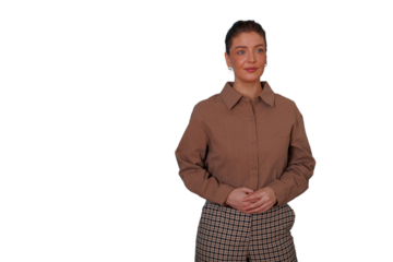 Young businesswoman standing in confident pose, wearing a brown shirt and plaid pants, cutout with transparent background