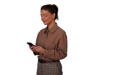 Woman smiling and texting on smartphone, dressed in business casual clothes, working remotely or communicating